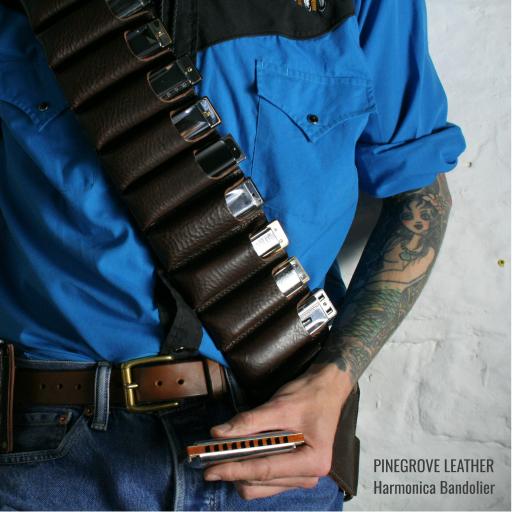 Model wearing Pinegrove Leather harmonica bandolier for 10 blues harps