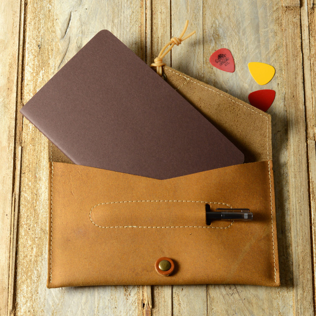 Pinegrove Leather Songwriter's Notebook Case, open, with a Moleskine notebook and pen